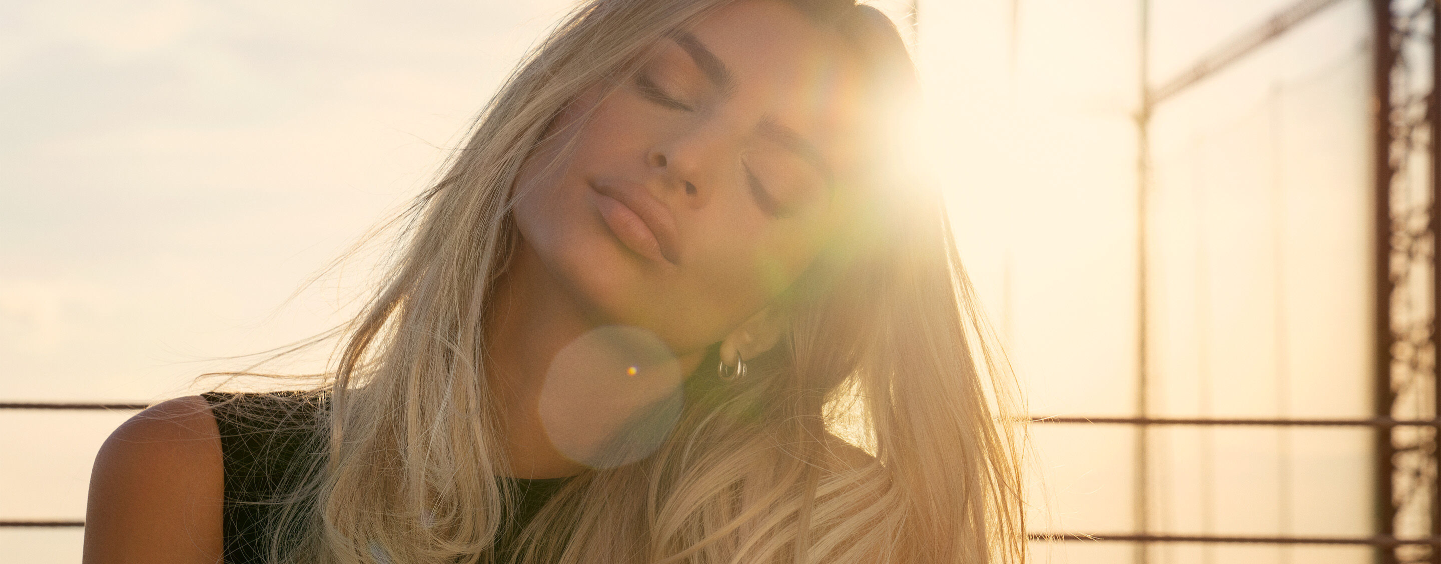 Model with blonde hair in the sunshine