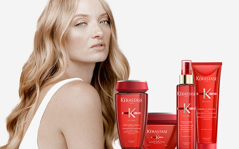 Kerastase Soleil model with hair care products for sun exposed hair.