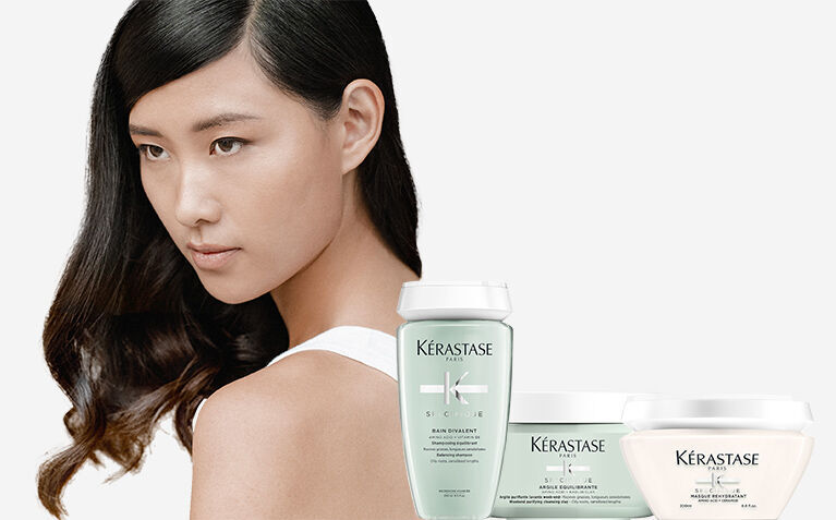 Kerastase Specifique model with hair care products for unbalanced scalps.