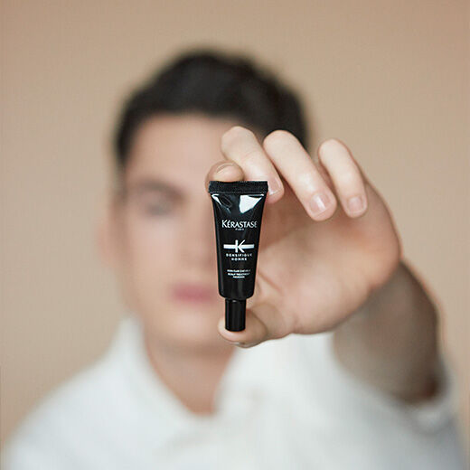 Man holding Densifique Bodifying Scalp Treatment