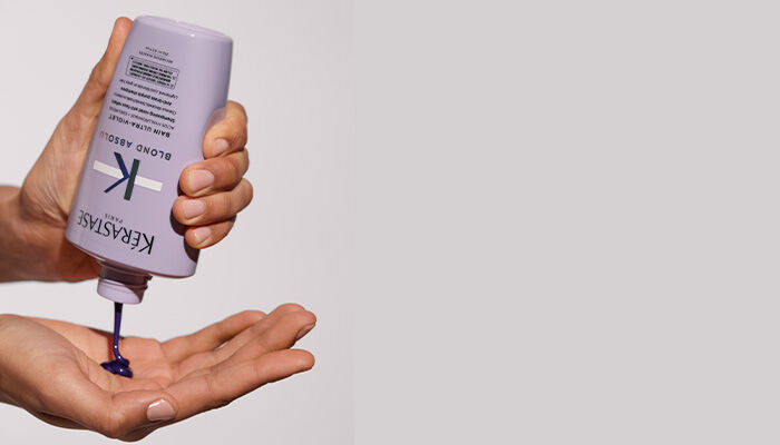 Blond Absolu Ultra Violet Shampoo squeezed into hand