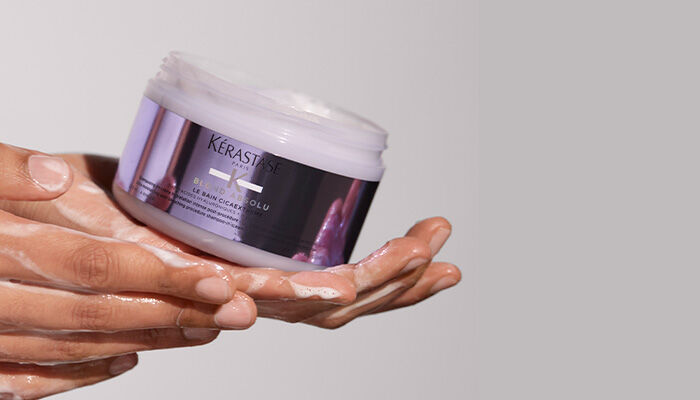 Blond Absolu Lumiere Shampoo squeezed into hand