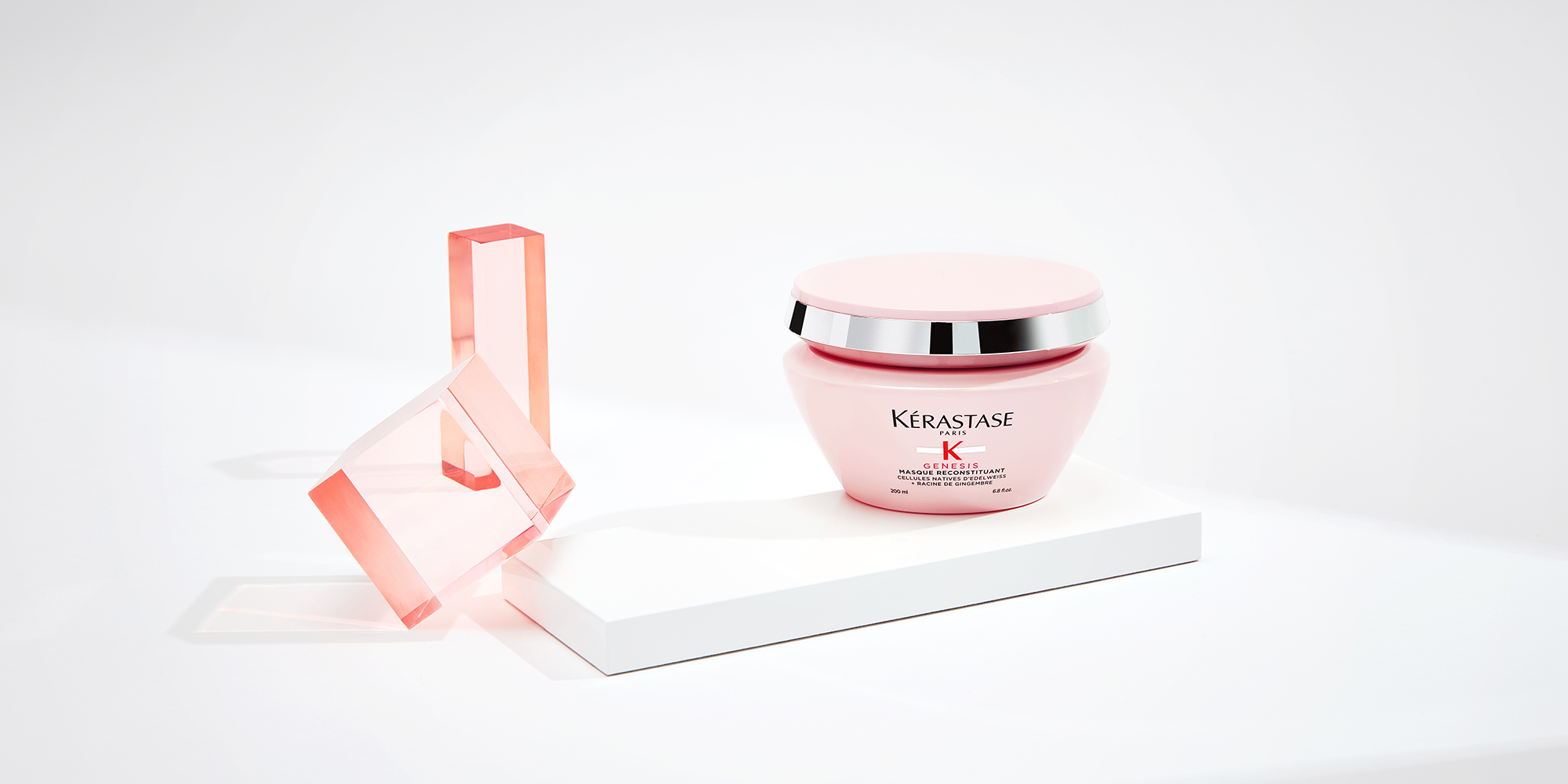 The Elixir Ultime hair mask and the new refillable Elixir Ultime hair oil are display on a pure beige background.